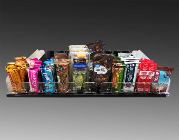 An image showing snack pushers holding small snacks like bars and nuts