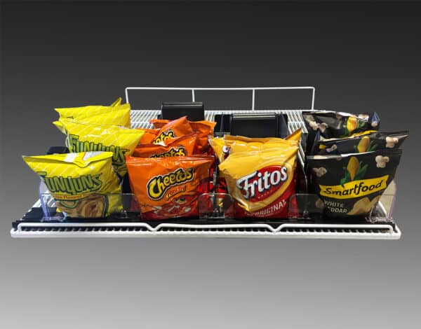 An image showing snack pushers holding large snacks like bags of chips and popcorn