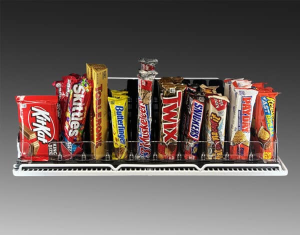 An image showing snack pushers holding small snacks like bars and boxes of candy